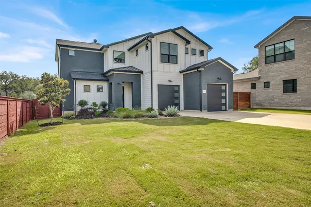 a front view of house with yard and swimming pool