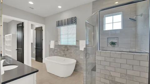 a bathroom with a double vanity sink mirror and shower