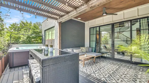 a view of balcony with wooden floor and fence