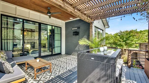 a view from deck with patio