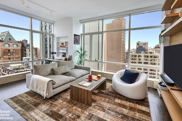 a living room with furniture and a large window