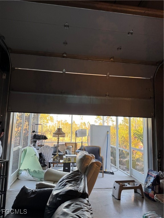 32576 Oil Well Road Punta Gorda, FL 33955 - Photo 12 of 30 a living room with furniture and floor to ceiling window