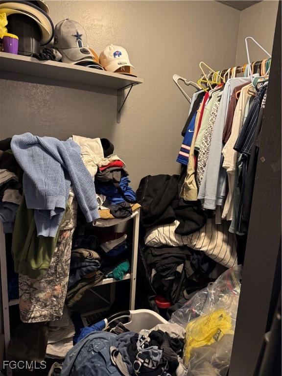 32576 Oil Well Road Punta Gorda, FL 33955 - Photo 15 of 30 a view of walk in closet with clothes and shoes