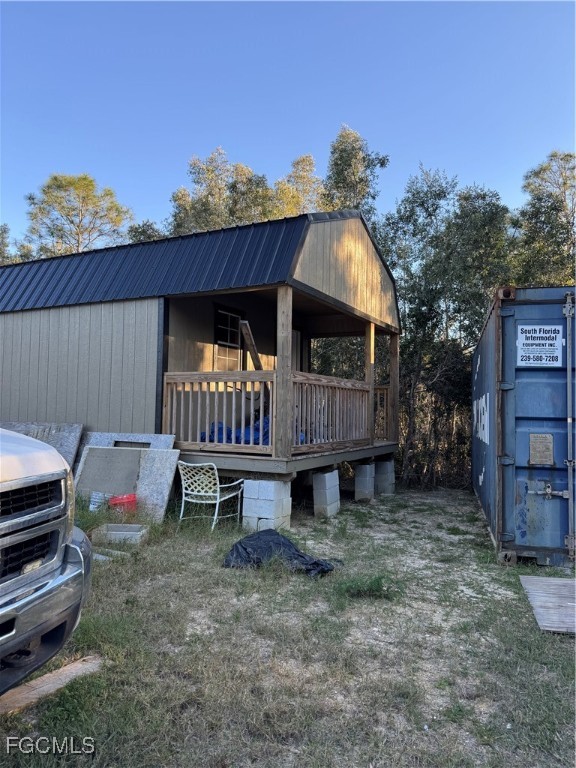 32576 Oil Well Road Punta Gorda, FL 33955 - Photo 16 of 30 a view of a house with a back yard and a chair