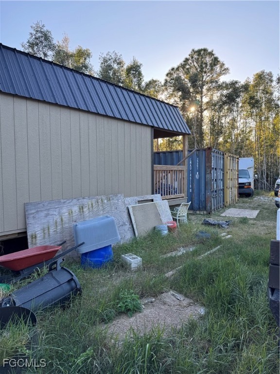 32576 Oil Well Road Punta Gorda, FL 33955 - Photo 19 of 30 a backyard of a house with table and chairs