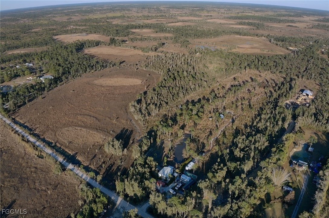 32576 Oil Well Road Punta Gorda, FL 33955 - Photo 23 of 30 a view of a dry yard with wooden floor