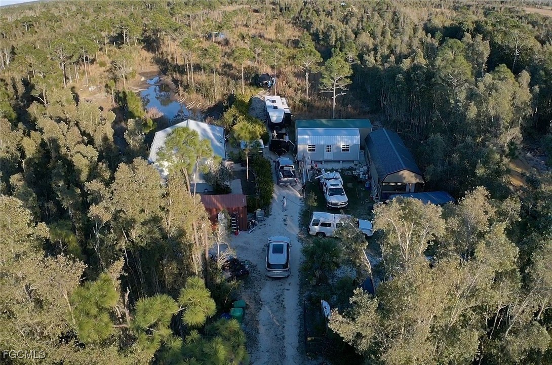 32576 Oil Well Road Punta Gorda, FL 33955 - Photo 28 of 30 an aerial view of houses covered with trees