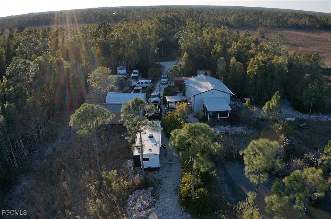 32576 Oil Well Road Punta Gorda, FL 33955 - Photo 29 of 30 a aerial view of a house with a yard basket ball court and outdoor seating