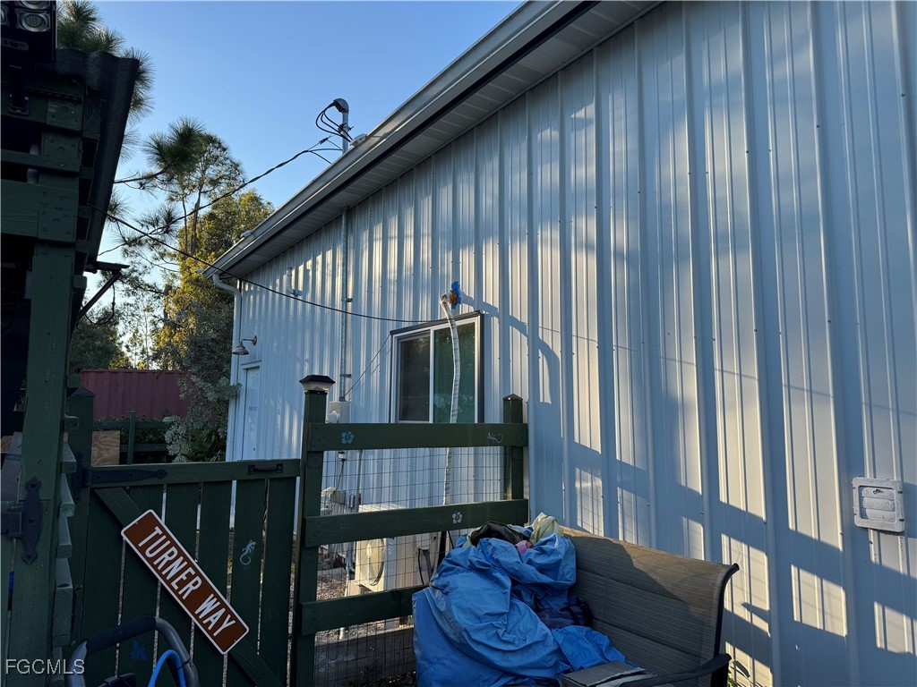 32576 Oil Well Road Punta Gorda, FL 33955 - Photo 3 of 30 a balcony with table and chairs