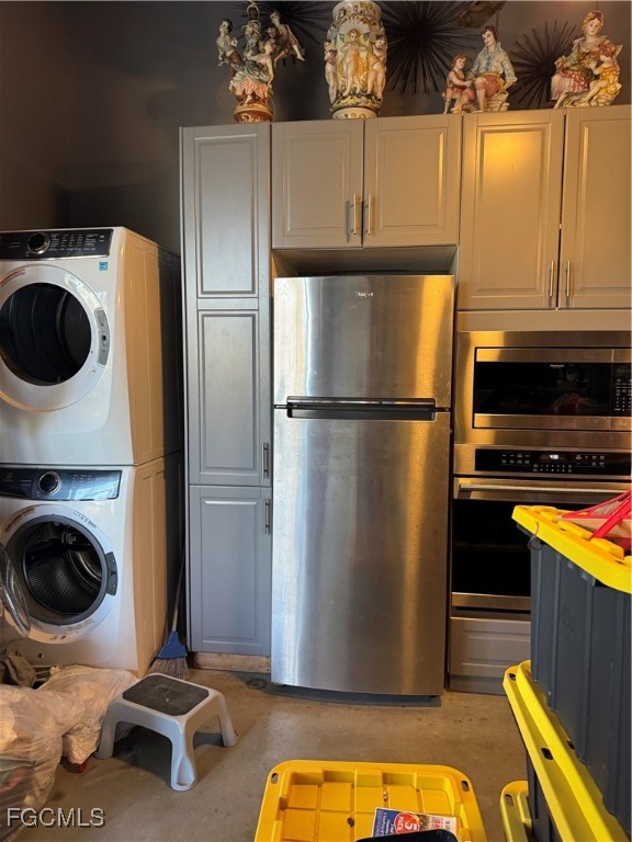 32576 Oil Well Road Punta Gorda, FL 33955 - Photo 4 of 30 a kitchen with a refrigerator a stove and a wooden floor