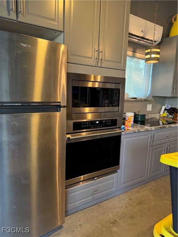 32576 Oil Well Road Punta Gorda, FL 33955 - Photo 7 of 30 a kitchen with a refrigerator and a stove top oven