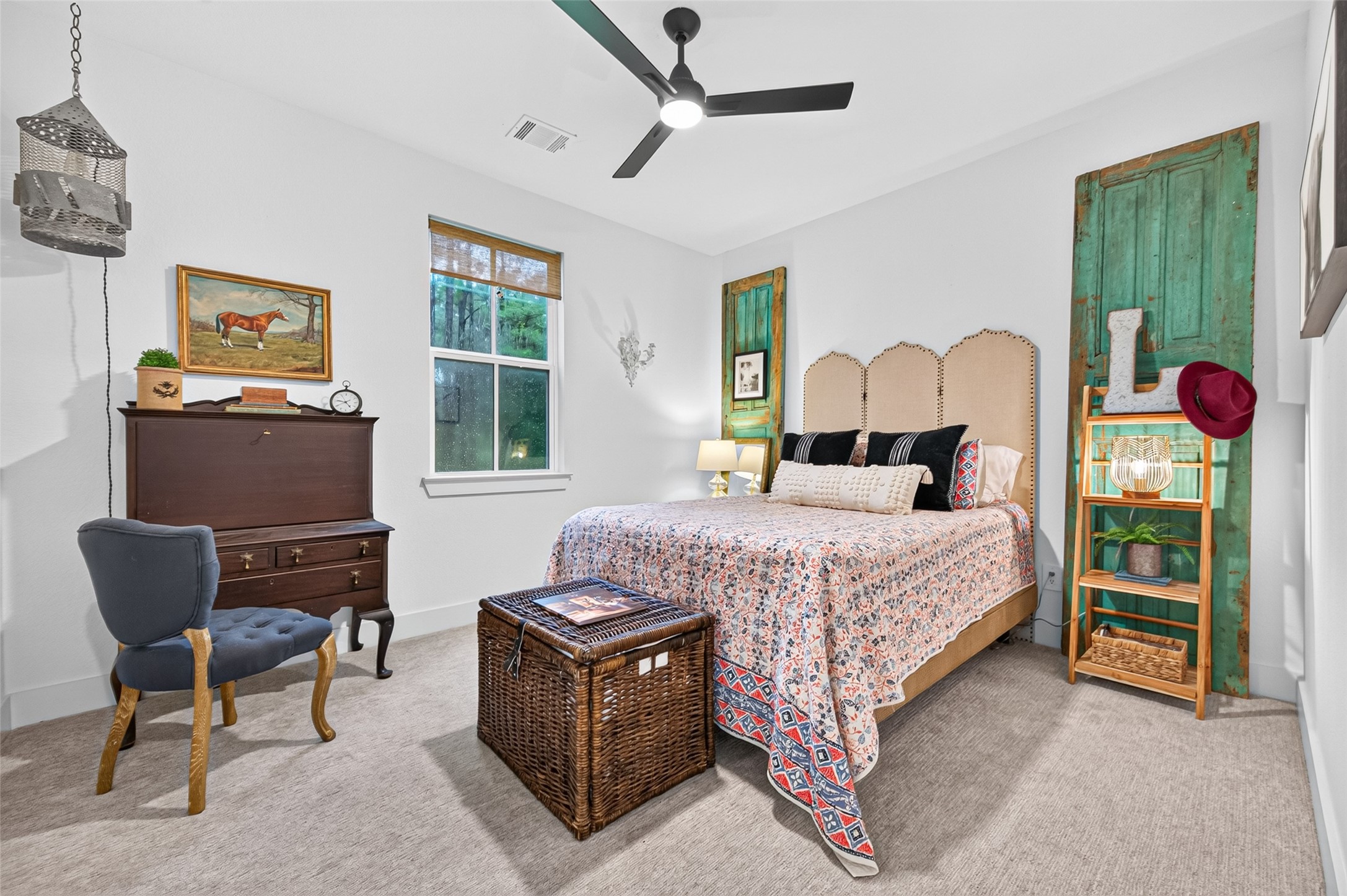 10915 Ruger Road Willis, TX 77378 - Photo 27 of 50 a bedroom with a bed and a chair