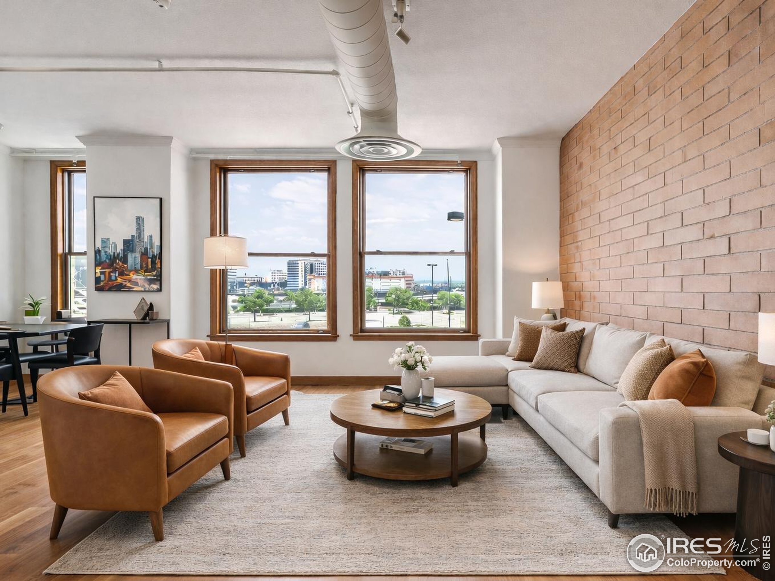 2245 Blake Street, Unit D Denver, CO 80205 - Photo 1 of 36 a living room with furniture and a large window