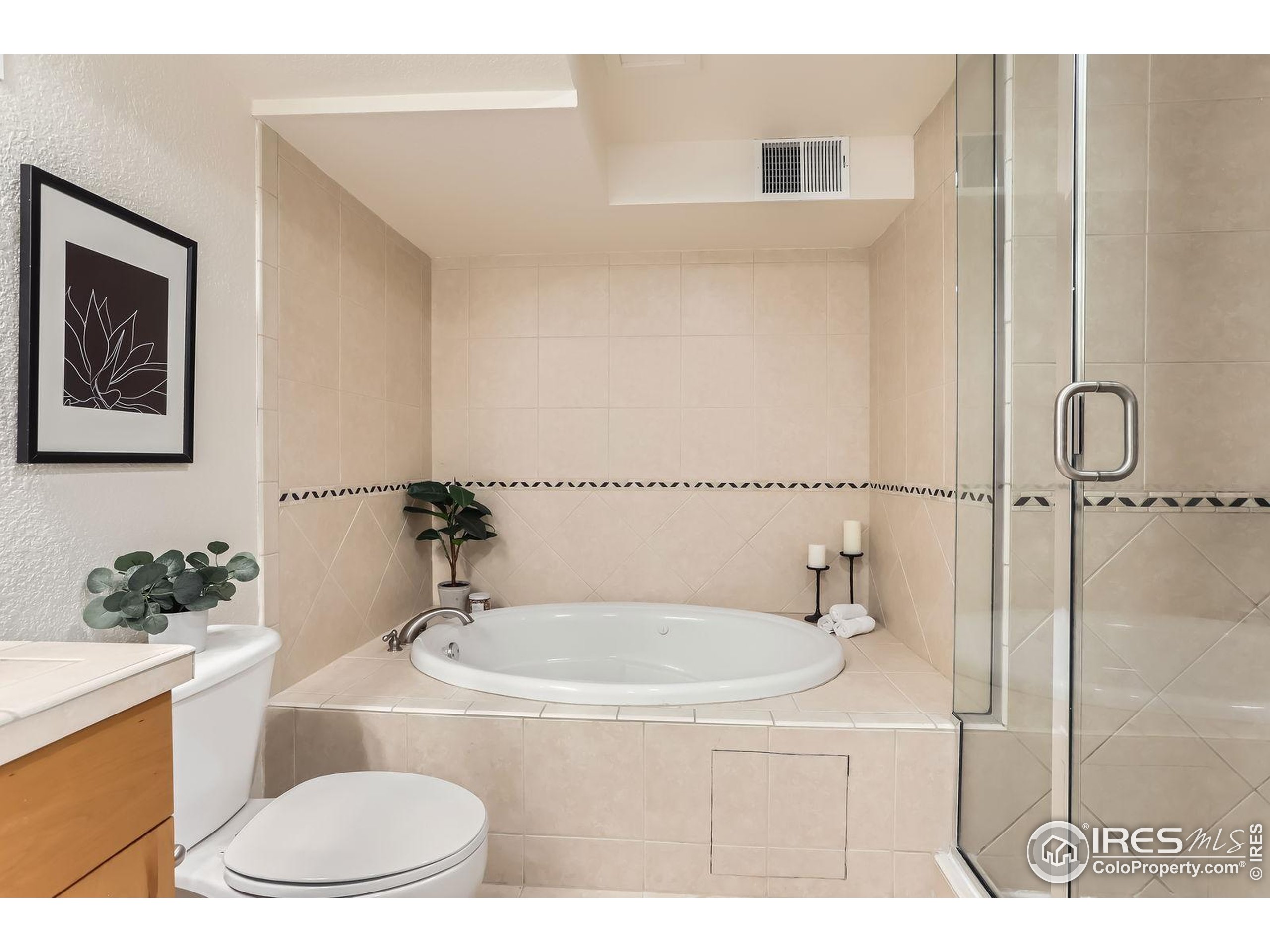 2245 Blake Street, Unit D Denver, CO 80205 - Photo 20 of 36 a bathroom with a sink and a mirror