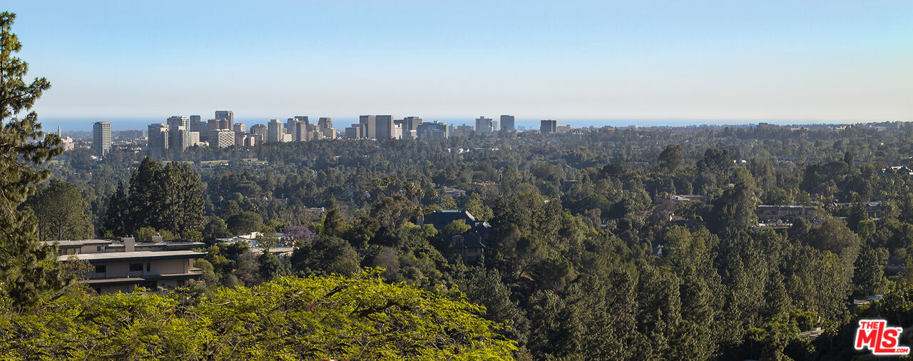 1131 Miradero Road Beverly Hills, CA 90210 - Photo 42 of 42 a view of a city with tall buildings