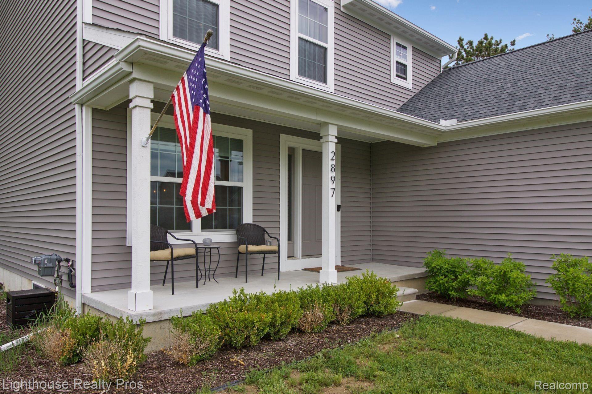 2897 Fisher Road Howell, MI 48855 - Photo 8 of 37 Enjoy coffee in the morning on the east facing covered front porch