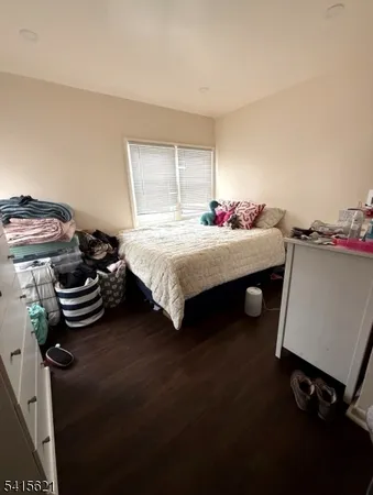 a bedroom with a bed and a desk