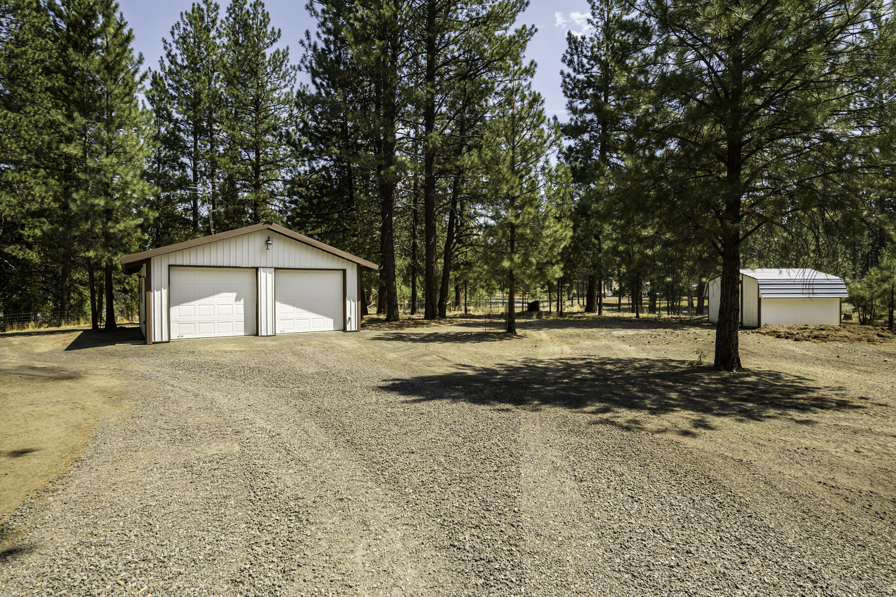 15730 Jackpine Road La Pine, OR 97739 - Photo 33 of 43 a house with trees in front of it