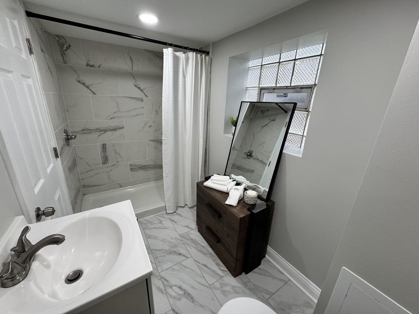 822 East 87th Place Chicago, IL 60619 - Photo 20 of 31 a bathroom with a sink toilet and shower