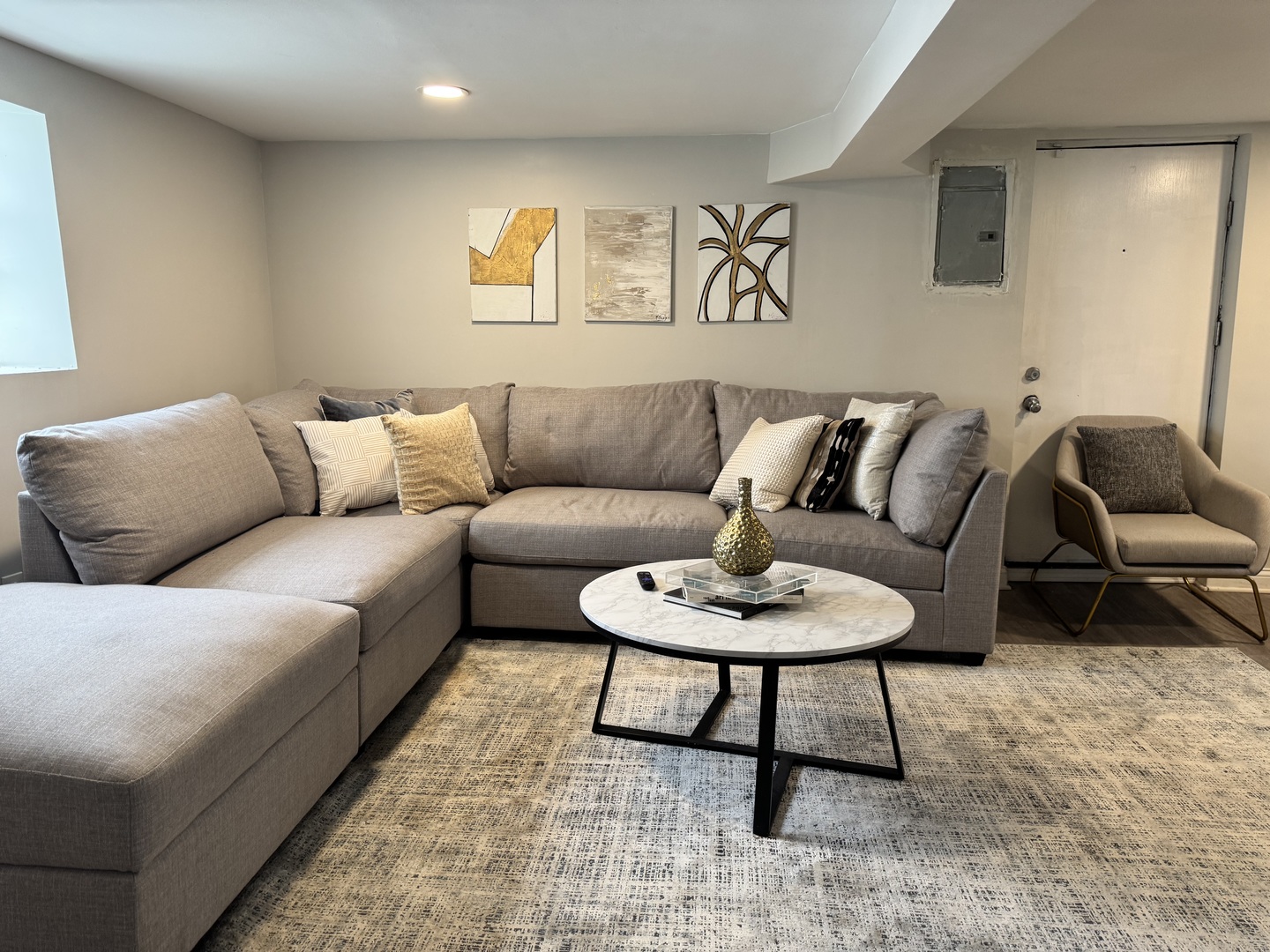 822 East 87th Place Chicago, IL 60619 - Photo 23 of 31 a living room with furniture a rug and a table