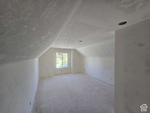 338 West 3400 South Logan, UT 84321 - Photo 27 of 40 Sloping attic ceiling with recessed lighting and a window