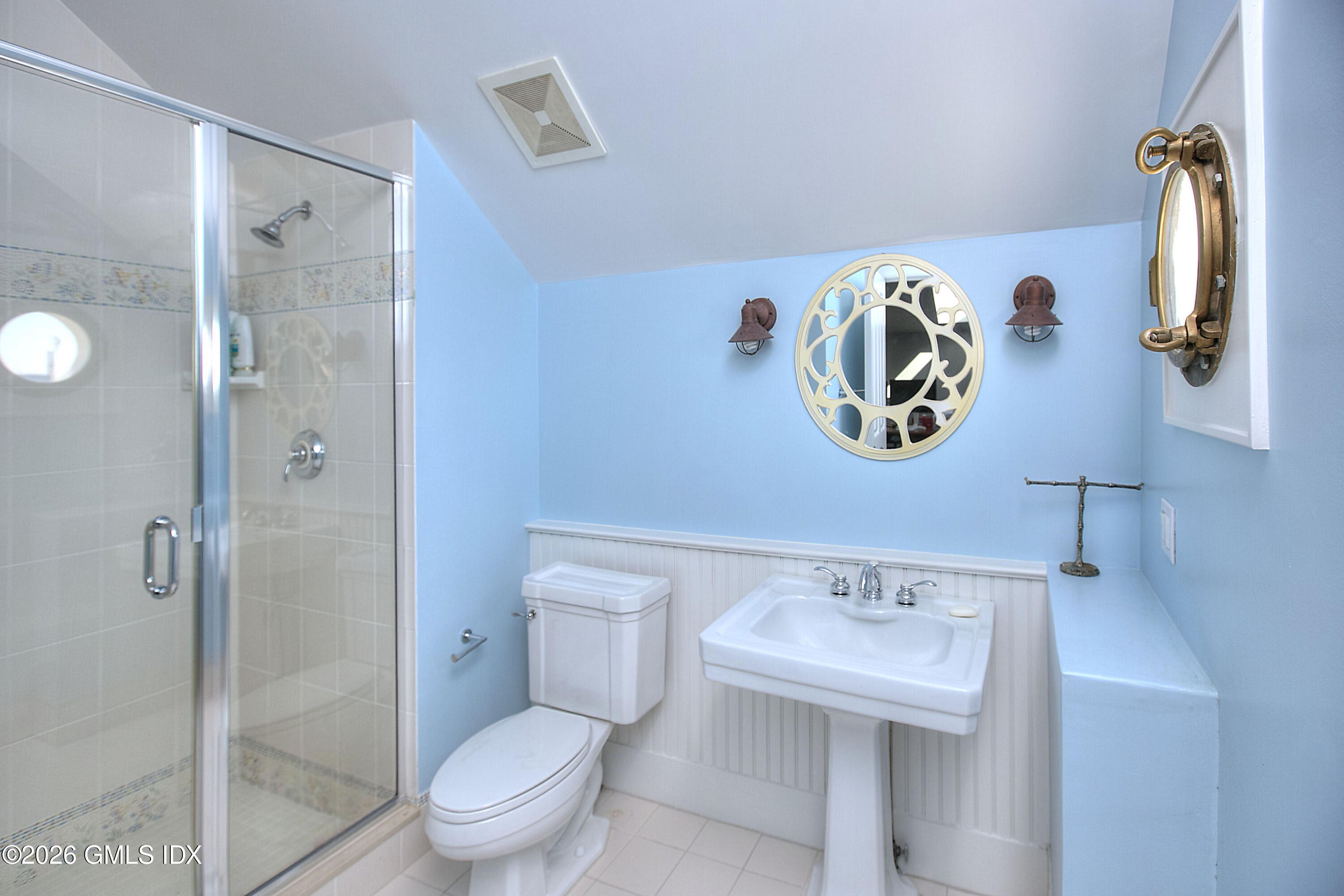 3 Shorehaven Road Norwalk, CT 06855 - Photo 35 of 40 a bathroom with a sink and a mirror