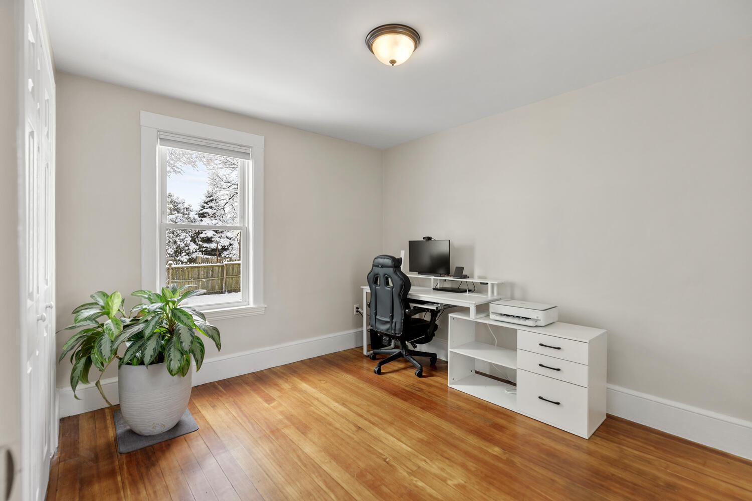 20 Fairmount Street Everett, MA 02149 - Photo 11 of 53 a view of a workspace with furniture and a window