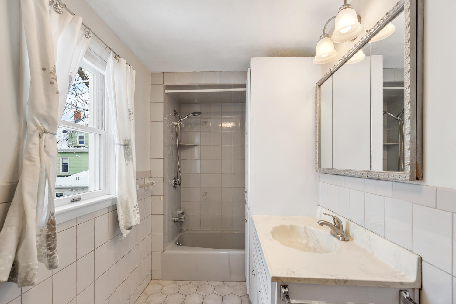 20 Fairmount Street Everett, MA 02149 - Photo 30 of 53 a bathroom with a sink a toilet and shower