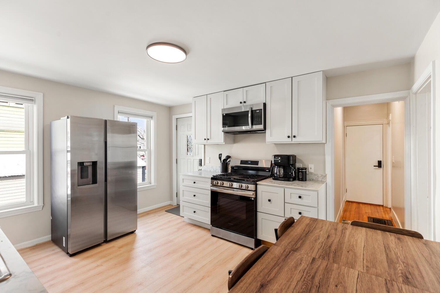 20 Fairmount Street Everett, MA 02149 - Photo 3 of 53 a kitchen with granite countertop a refrigerator stove top oven and sink