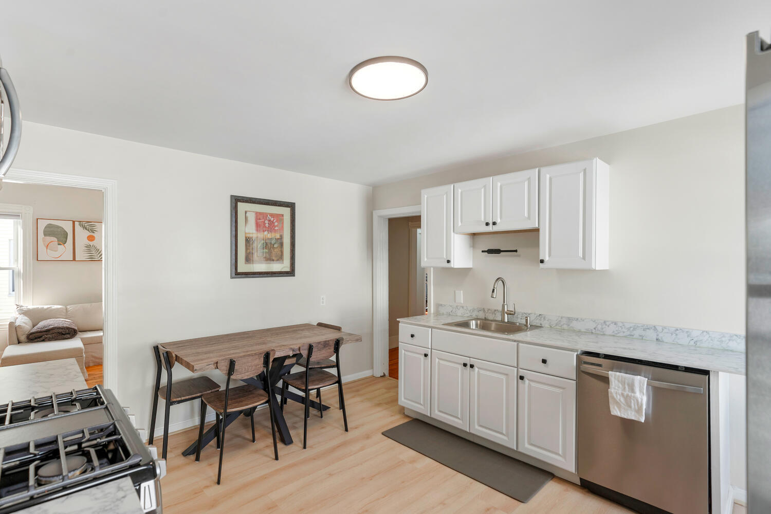 20 Fairmount Street Everett, MA 02149 - Photo 4 of 53 a kitchen with a table and chairs in it