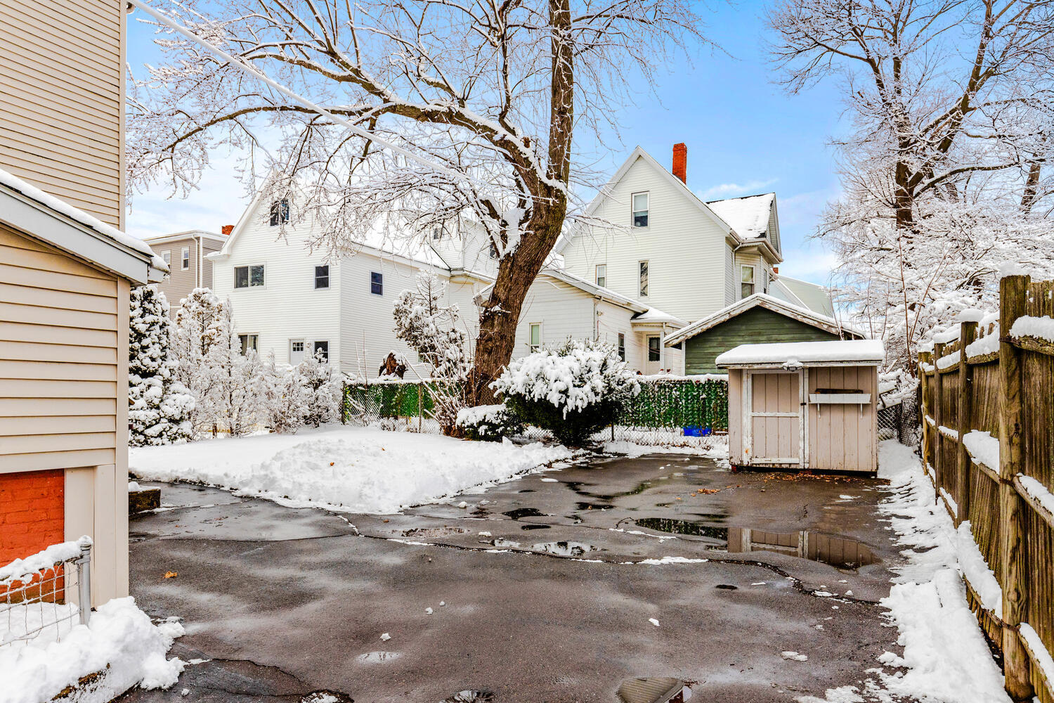 20 Fairmount Street Everett, MA 02149 - Photo 47 of 53 a view of a white house with a snow on the road