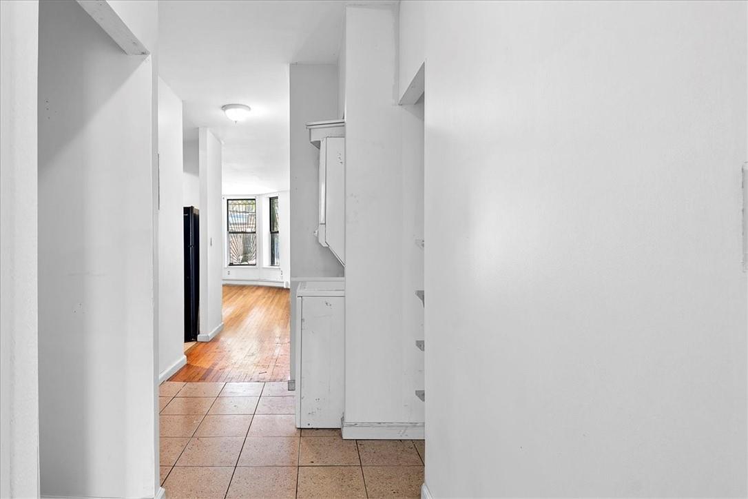 1012 Faile Street, Unit 1012A Bronx, NY 10459 - Photo 10 of 20 a view of entryway and hall with wooden floor