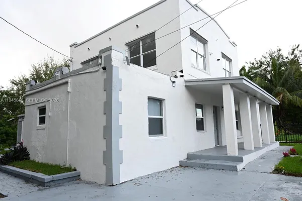 a view of a house with a street
