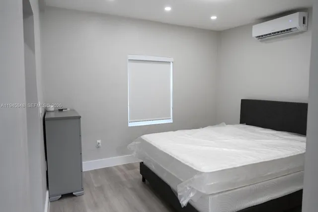 a bedroom with a bed and a closet