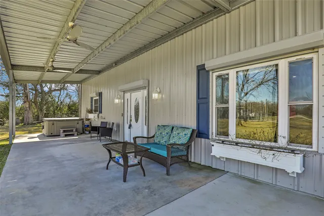 a view of a livingroom with furniture and stairs