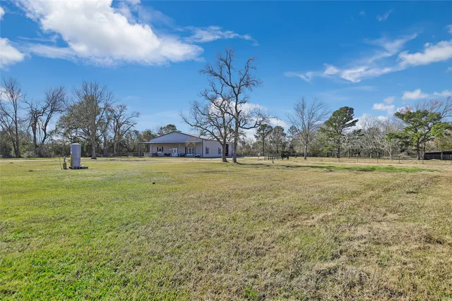 a view of a backyard of the house