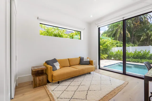 a living room with a couch and a large window