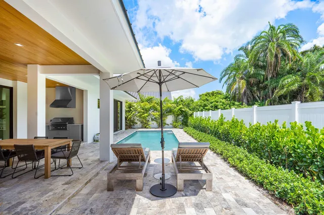 an outdoor space with furniture and umbrella