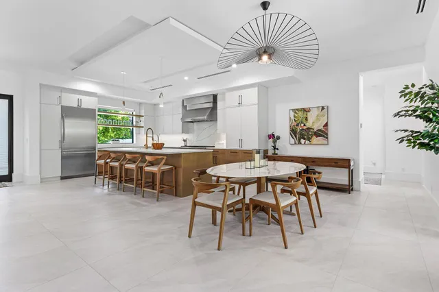 a dining room with furniture and window