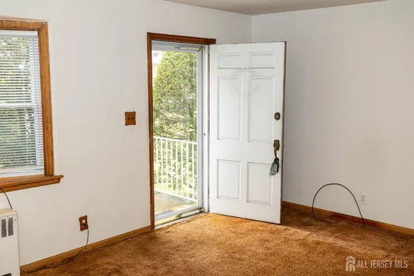 a view of a room that has a window in it