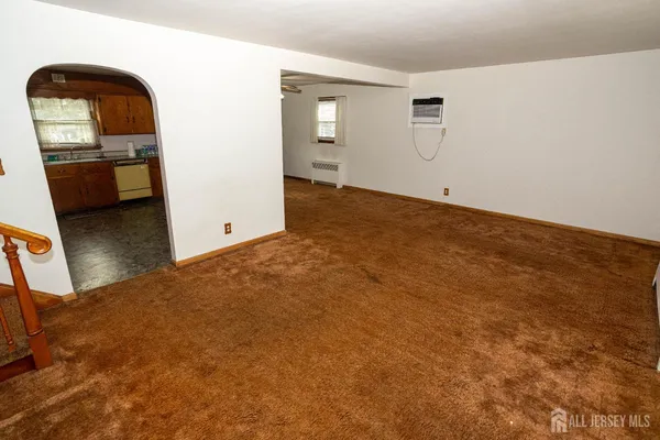 a view of a livingroom with wooden floor