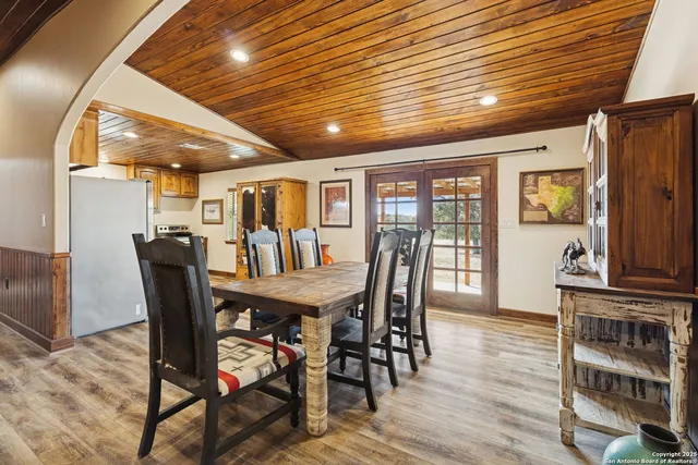 a spacious bathroom with a granite countertop sink and a mirror