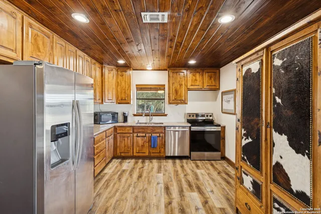 a backyard of a house with large trees