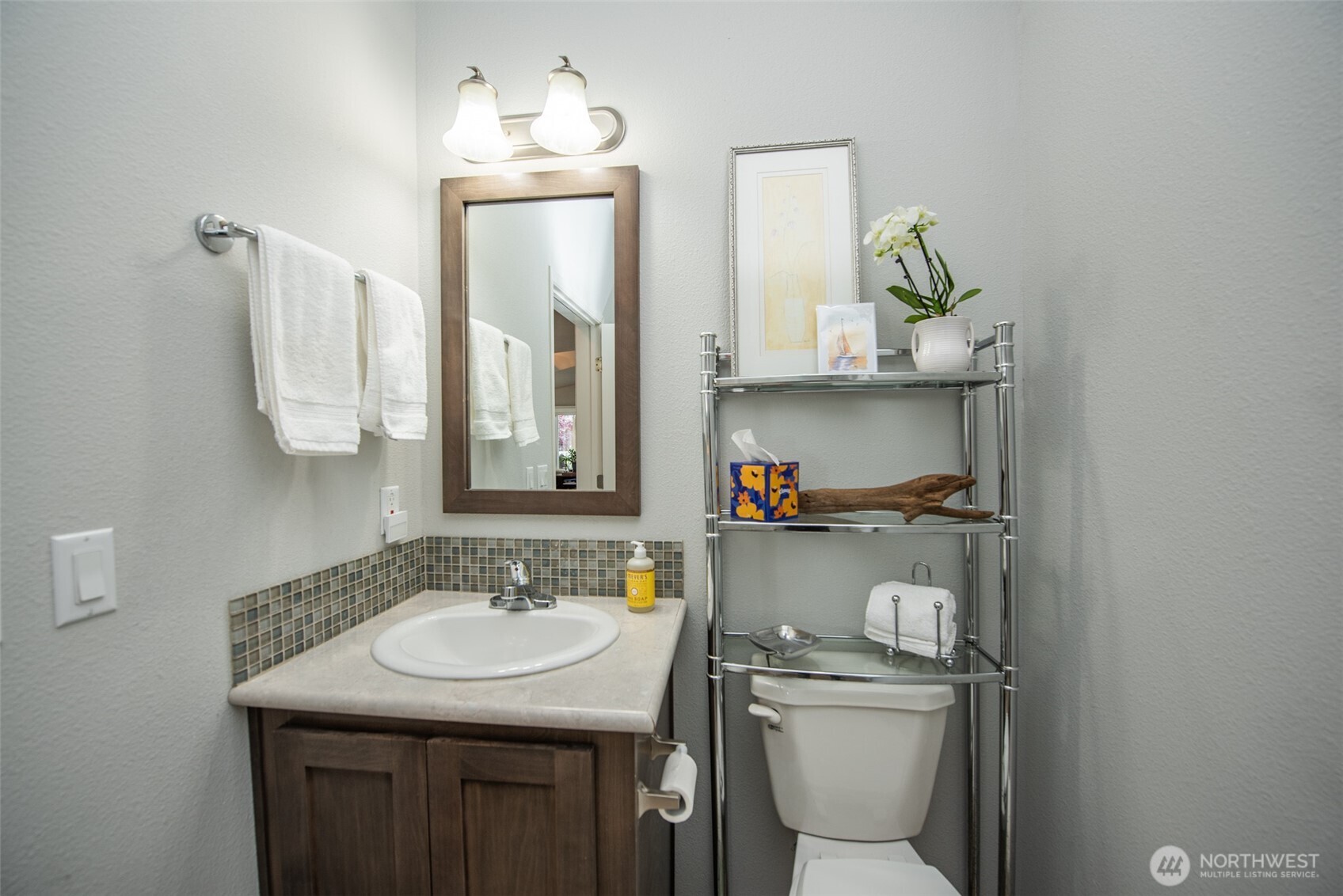 720 West Heritage Loop Sequim, WA 98382 - Photo 27 of 35 a bathroom with a granite countertop sink a toilet and mirror