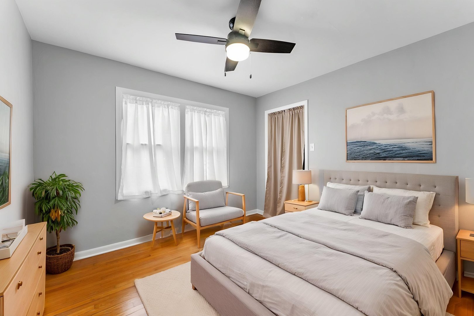 1419 113th Avenue Milan, IL 61264 - Photo 16 of 25 a bedroom with a bed and a chandelier