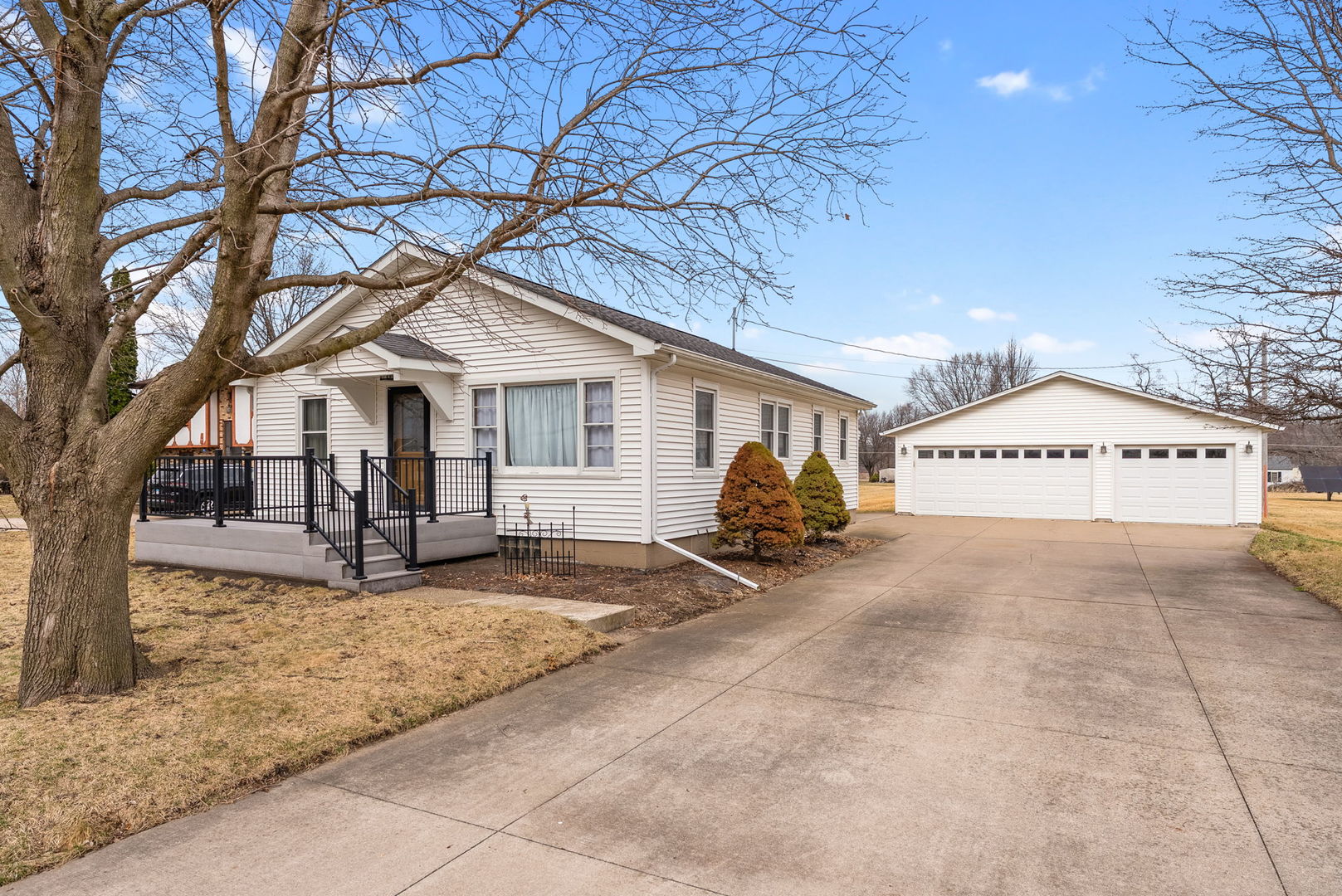 1419 113th Avenue Milan, IL 61264 - Photo 2 of 25 a view of a house with a snow and a tree