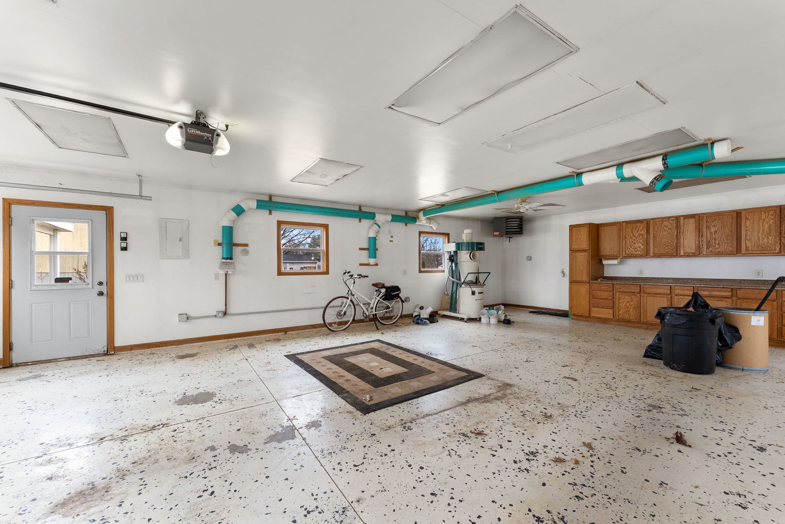 1419 113th Avenue Milan, IL 61264 - Photo 24 of 25 a view of a livingroom with hardwood floor and a ceiling fan