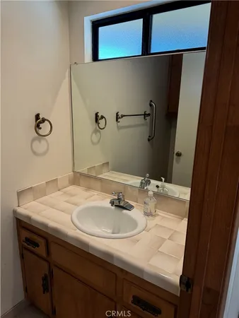 a bathroom with a sink and a mirror