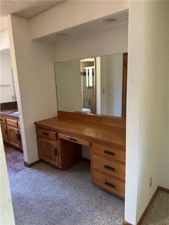 a room with furniture and mirror