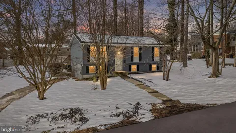 a living room with furniture a rug and a window